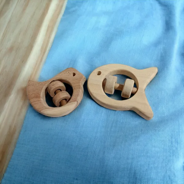 Set_of_2_Chemical_Free_Natural_Neem_Wooden_Rattles_of_Shapes_-Dove_&_Fish