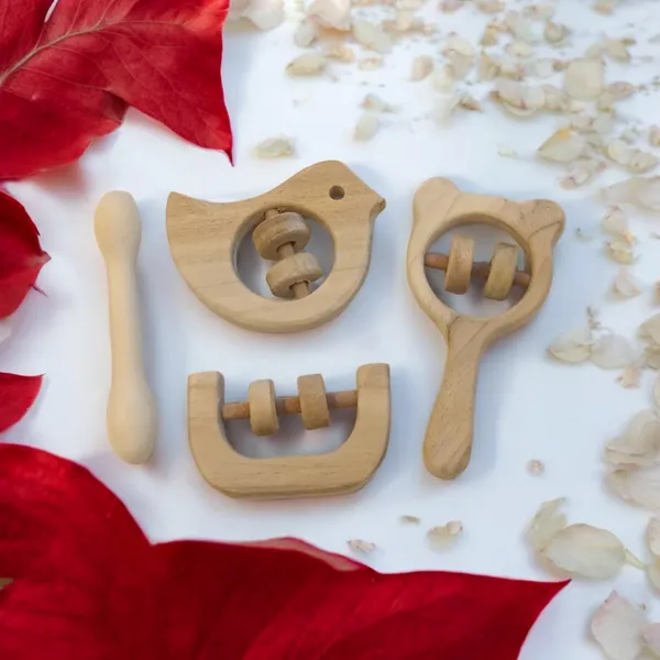 Beautiful_Dove,_Mickey_Head,_C_Shaped_Rattles_&_Dumbbell_Shaped_Teether_made_from_Pure_Neem_Wood