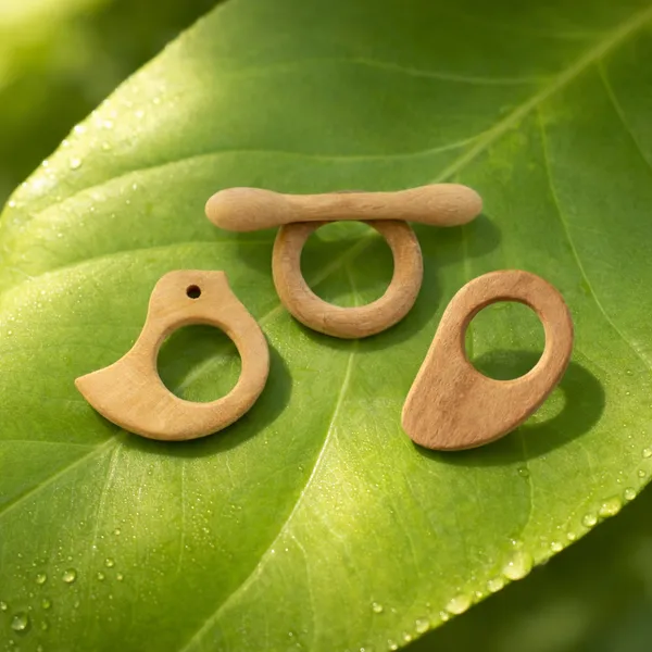 Neem_Wooden_Teethers_For_Babies_of_Age_0_To_3_Years_|_Dumb_bell,_Ring,_Mango_&_Dove_Shapes