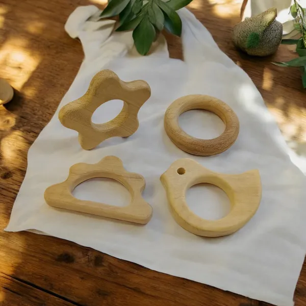 Pack_of_4_Neem_Wooden_Teethers_For_Babies_of_Age_0_To_3_Years_|_Ring,_Flower,_Dove_&_Cloud_Shapes