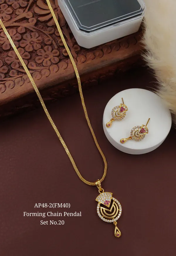 https://d1311wbk6unapo.cloudfront.net/NushopCatalogue/tr:f-webp,w-600,fo-auto/65784ce6785657b57c9b5ccb/cat_img/Trendy_Design_AD_Diamond_Copper_Gold_Forming_Plated_Pendant_Set_For_Women_And_Girls_LJSJ4KR6VZ_2024-09-04_1.jpg__Grisha Jewellery