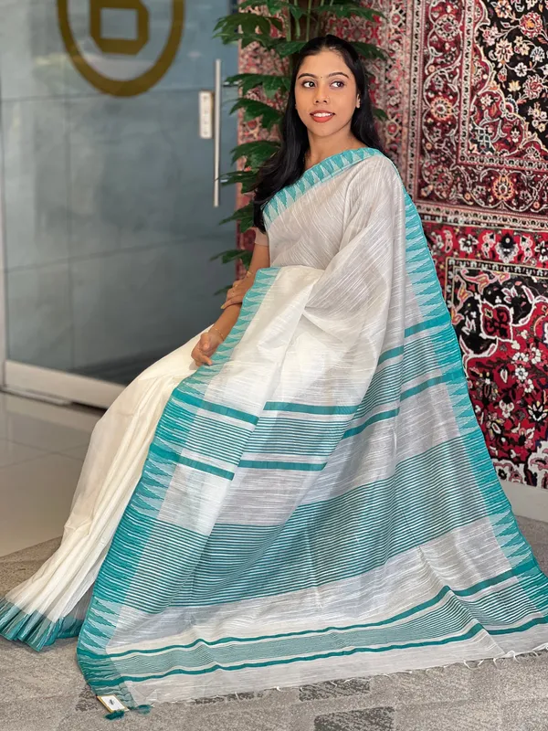 Turquoise_women's_Bhagalpuri_Kota_Viscous_Temple_Border_White_Saree_And_Variable_Color_Border_With_Blouse_Piece