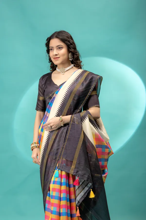 Soft_Tussar_Silk_sarees_with_Beautiful_Srikalahasti_Style_Of_Kalamkari_Digital_Print_With_Patola-style_Ikat:_The_central_multicolored_section_uses_a_digital_print_that_mimics_the_double-ikat_(Patola)_technique,_creating_a_blurred,_"grid-like"_geometric_effect_in_rainbow_hues._This_is_a_staple_in_traditional_South_Indian_textiles__And_Digital_Print_Blouse_With_Tassels