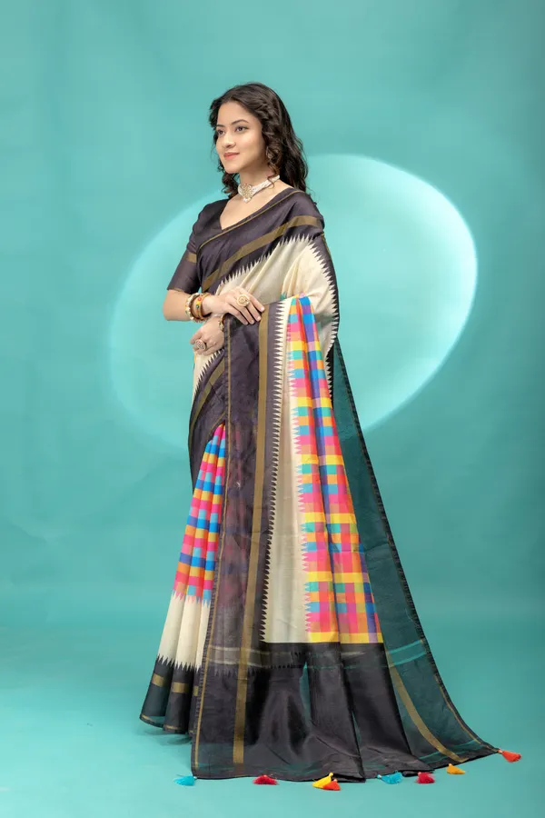 Soft_Tussar_Silk_sarees_with_Beautiful_Srikalahasti_Style_Of_Kalamkari_Digital_Print_With_Patola-style_Ikat:_The_central_multicolored_section_uses_a_digital_print_that_mimics_the_double-ikat_(Patola)_technique,_creating_a_blurred,_"grid-like"_geometric_effect_in_rainbow_hues._This_is_a_staple_in_traditional_South_Indian_textiles__And_Digital_Print_Blouse_With_Tassels