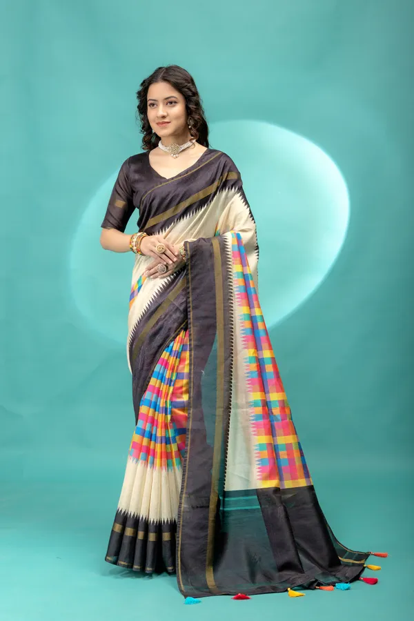 Soft_Tussar_Silk_sarees_with_Beautiful_Srikalahasti_Style_Of_Kalamkari_Digital_Print_With_Patola-style_Ikat:_The_central_multicolored_section_uses_a_digital_print_that_mimics_the_double-ikat_(Patola)_technique,_creating_a_blurred,_"grid-like"_geometric_effect_in_rainbow_hues._This_is_a_staple_in_traditional_South_Indian_textiles__And_Digital_Print_Blouse_With_Tassels
