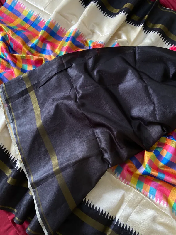 Soft_Tussar_Silk_sarees_with_Beautiful_Srikalahasti_Style_Of_Kalamkari_Digital_Print_With_Patola-style_Ikat:_The_central_multicolored_section_uses_a_digital_print_that_mimics_the_double-ikat_(Patola)_technique,_creating_a_blurred,_"grid-like"_geometric_effect_in_rainbow_hues._This_is_a_staple_in_traditional_South_Indian_textiles__And_Digital_Print_Blouse_With_Tassels
