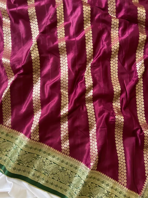 Banarasi_Pure_Satin_Silk_sarees_with_Beautiful_Elephant_in_Contrast_Green-Wine_Shades_With_Attractive_Weaving_Gold_Zari_Design_And_Contrast_Blouse_With_Tassels