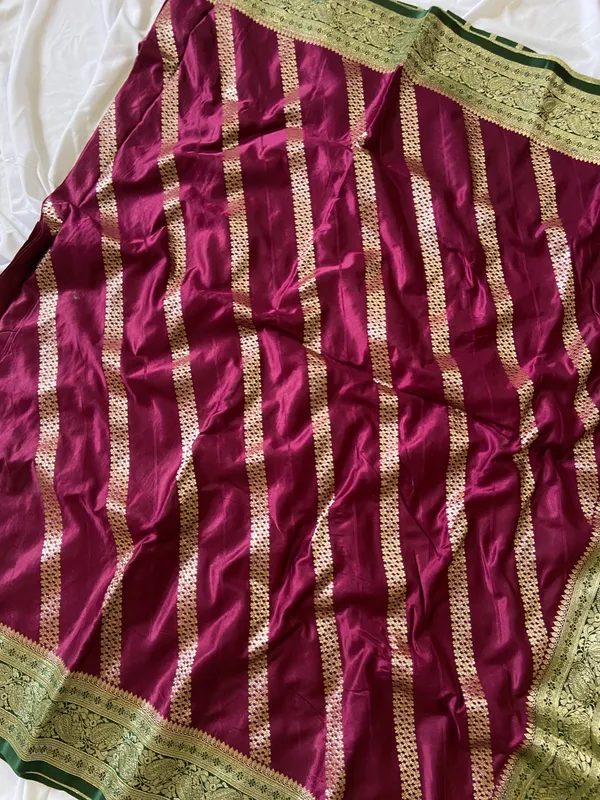 Banarasi_Pure_Satin_Silk_sarees_with_Beautiful_Elephant_in_Contrast_Green-Wine_Shades_With_Attractive_Weaving_Gold_Zari_Design_And_Contrast_Blouse_With_Tassels