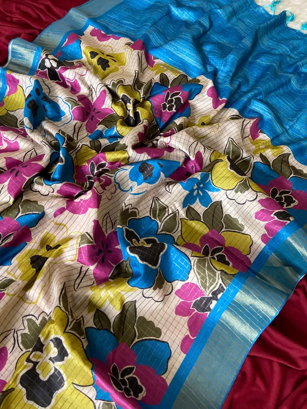 Soft_Tussar_Silk_sarees_with_Beautiful_Style_Of_Floral_Digital_Print_With_Attractive_Border_And_Contrast_Print_Blouse_With_Tassels