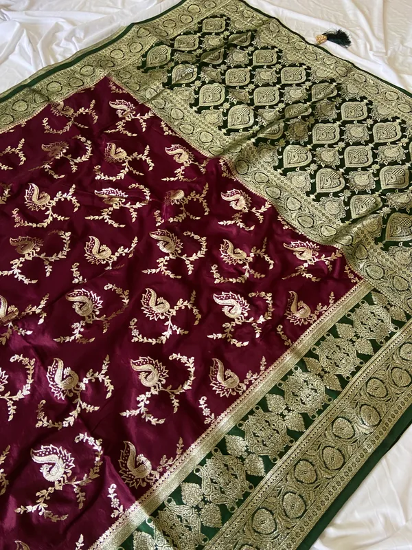 Banarasi_Pure_Satin_Silk_sarees_with_Beautiful_Peacock_in_Contrast_Green-Wine_Shades_With_Attractive_Weaving_Gold_Zari_Design_And_Contrast_Blouse_With_Tassels