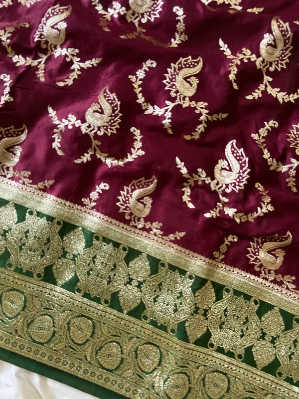 Banarasi_Pure_Satin_Silk_sarees_with_Beautiful_Peacock_in_Contrast_Green-Wine_Shades_With_Attractive_Weaving_Gold_Zari_Design_And_Contrast_Blouse_With_Tassels
