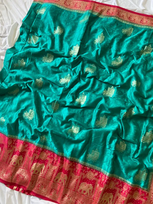 Banarasi_Pure_Satin_Silk_sarees_with_Beautiful_Elephant_in_Contrast_Pink-Rama_Shades_With_Attractive_Weaving_Gold_Zari_Design_And_Contrast_Blouse_With_Tassels