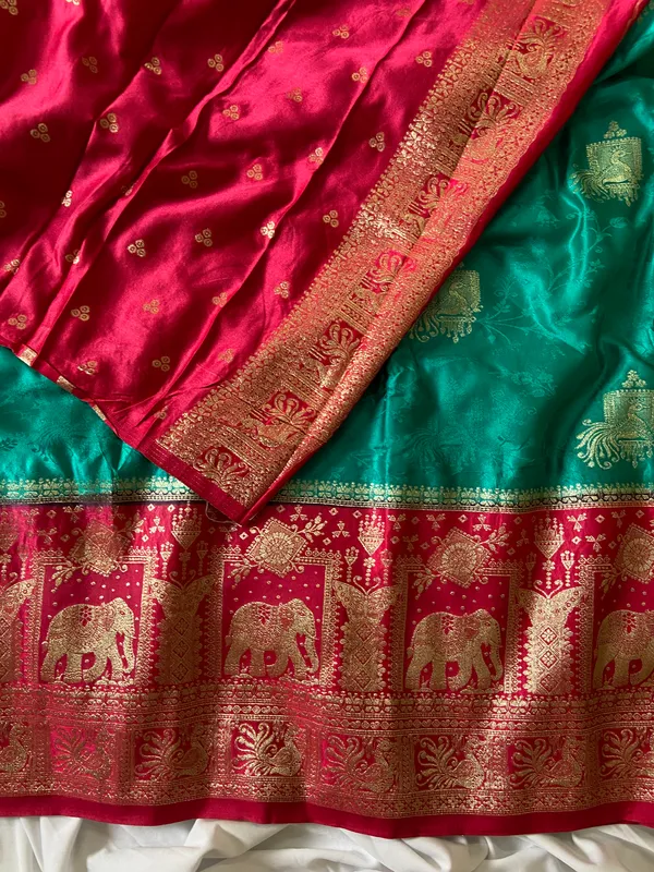 Banarasi_Pure_Satin_Silk_sarees_with_Beautiful_Elephant_in_Contrast_Pink-Rama_Shades_With_Attractive_Weaving_Gold_Zari_Design_And_Contrast_Blouse_With_Tassels