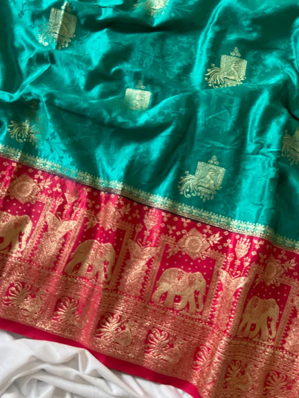 Banarasi_Pure_Satin_Silk_sarees_with_Beautiful_Elephant_in_Contrast_Pink-Rama_Shades_With_Attractive_Weaving_Gold_Zari_Design_And_Contrast_Blouse_With_Tassels