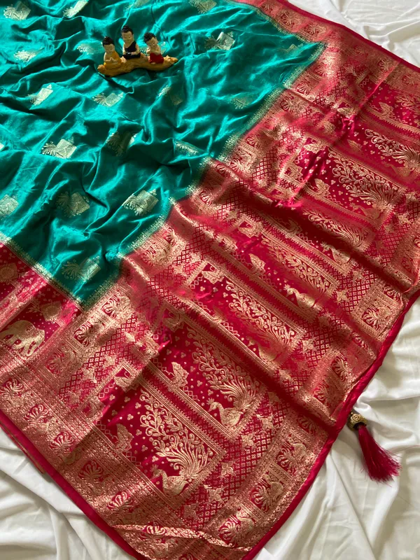 Banarasi_Pure_Satin_Silk_sarees_with_Beautiful_Elephant_in_Contrast_Pink-Rama_Shades_With_Attractive_Weaving_Gold_Zari_Design_And_Contrast_Blouse_With_Tassels