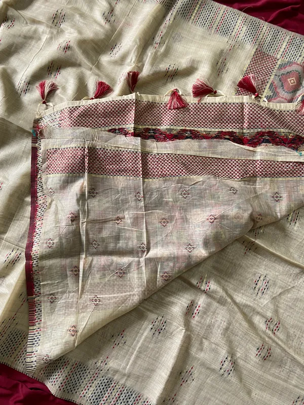 Premium_Soft_Muga_Cotton_sarees_with_Beautiful_Colourfull_3D_Woven_Small_Motifs_Pallu_With_Attractive_All_Over_Resham_Weaving_Butti_Design_With_Resham_Weaving_Border_And_Resham_Weaving_Butti_Blouse_With_Fancy_Tassels