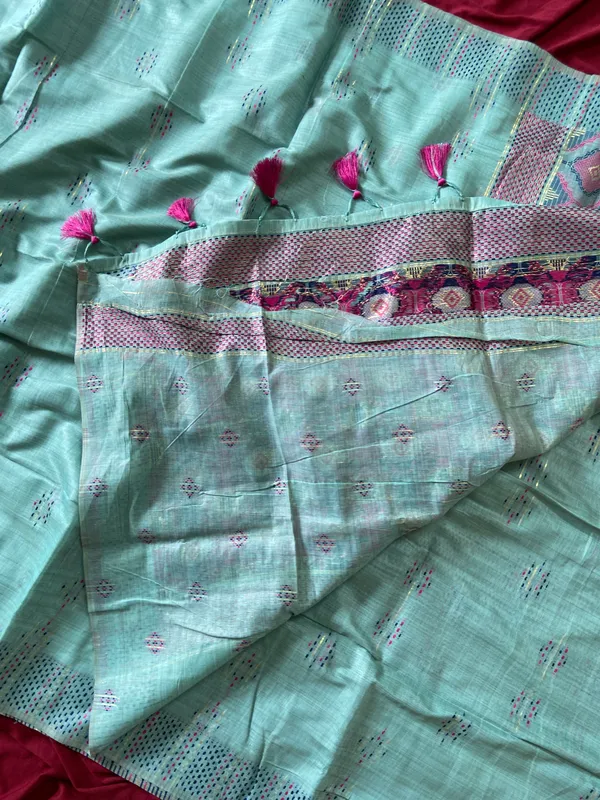 Premium_Soft_Muga_Cotton_sarees_with_Beautiful_Colourfull_3D_Woven_Small_Motifs_Pallu_With_Attractive_All_Over_Resham_Weaving_Butti_Design_With_Resham_Weaving_Border_And_Resham_Weaving_Butti_Blouse_With_Fancy_Tassels