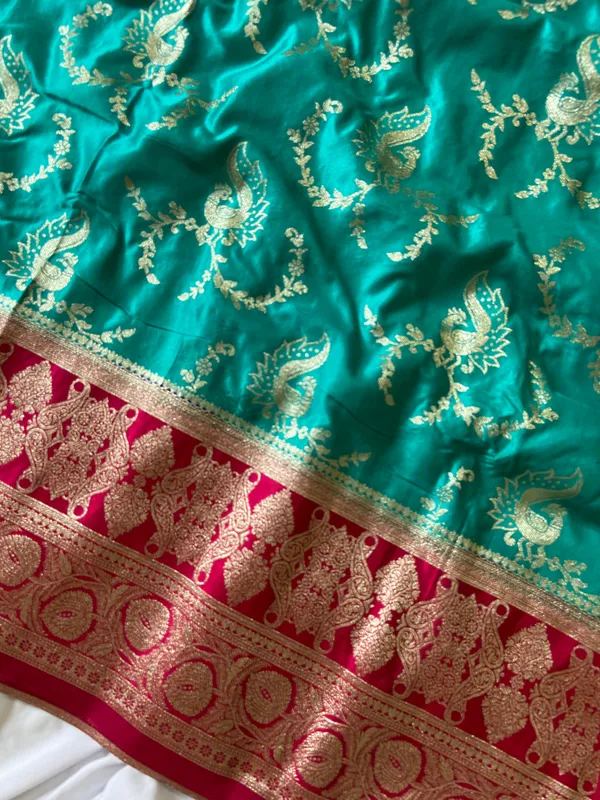 Banarasi_Pure_Satin_Silk_sarees_with_Beautiful_Peacock_in_Contrast_Pink-Rama_Shades_With_Attractive_Weaving_Gold_Zari_Design_And_Contrast_Blouse_With_Tassels