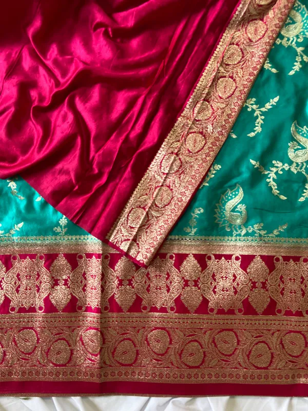 Banarasi_Pure_Satin_Silk_sarees_with_Beautiful_Peacock_in_Contrast_Pink-Rama_Shades_With_Attractive_Weaving_Gold_Zari_Design_And_Contrast_Blouse_With_Tassels