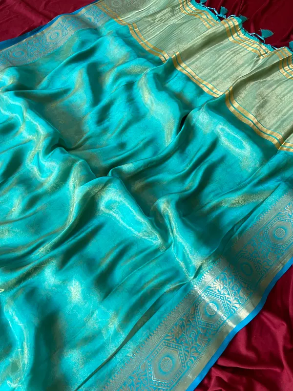 Premium_Soft_Fandy_Satin_sarees_with_Beautiful_Self_Design_Weaving__Pallu_With_Attractive_Traditional_Zari_Weaving__Border_With_All_Over_Self_Weaving__Design_And_Self_Design_Weaving__Blouse_With_Fancy_Tassels
