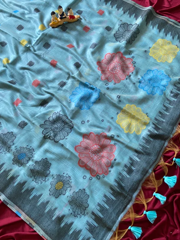 Premium_Soft_Muga_Cotton_sarees_with_Beautiful_Colourfull_3D_Woven_Flower_Design_Pallu_With_Attractive_All_Over_Resham_Weaving_Butti_Design_With_Resham_Weaving_Border_And_Resham_Weaving_Butti_Blouse_With_Fancy_Tassels