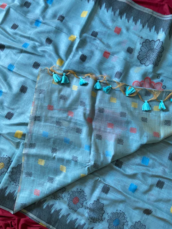Premium_Soft_Muga_Cotton_sarees_with_Beautiful_Colourfull_3D_Woven_Flower_Design_Pallu_With_Attractive_All_Over_Resham_Weaving_Butti_Design_With_Resham_Weaving_Border_And_Resham_Weaving_Butti_Blouse_With_Fancy_Tassels