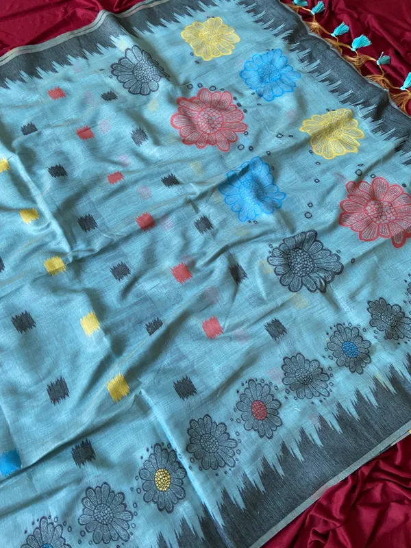 Premium_Soft_Muga_Cotton_sarees_with_Beautiful_Colourfull_3D_Woven_Flower_Design_Pallu_With_Attractive_All_Over_Resham_Weaving_Butti_Design_With_Resham_Weaving_Border_And_Resham_Weaving_Butti_Blouse_With_Fancy_Tassels