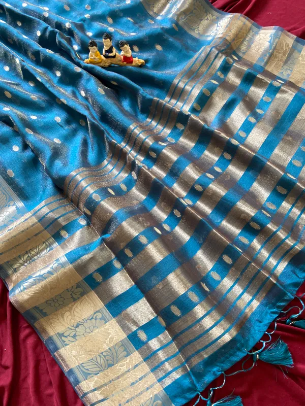 Premium_Soft_Khadi_Shimmer_sarees_with_Beautiful_Butti_Design_Weaving__Pallu_With_Attractive_Traditional_Zari_Weaving__Border_With_All_Over_Butti_Weaving__Design_And_Butti_Design_Weaving__Blouse_With_Fancy_Tassels