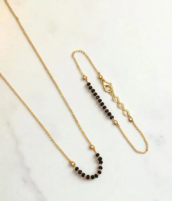 micro_gold_plated_elegant_simple_black_beeds_mangalsutra_with_hand_ms