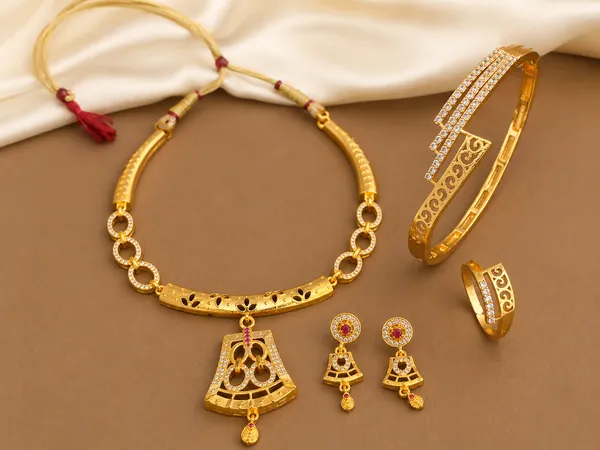 Designer_Micro_Gold_Plated_AD_Diamond_Studded_Traditional_Pendant_Set_with_Adjustable_Bracelet_&_Ring_Combo