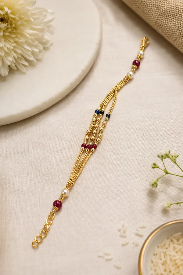 Premium_Gold-Plated_Bhabhi_Rakhi_with_Pearl_&_Ruby_Beads