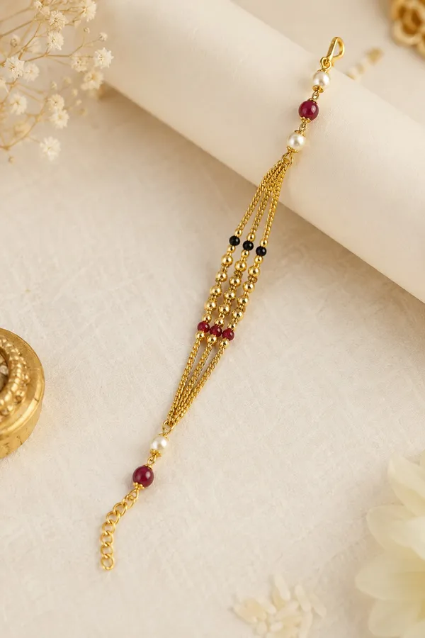 Premium_Gold-Plated_Bhabhi_Rakhi_with_Pearl_&_Ruby_Beads