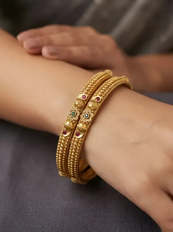 Elegant_Traditional_Daily_Wear_Gold_floral_Bangles_with_Gemstone_Detailing