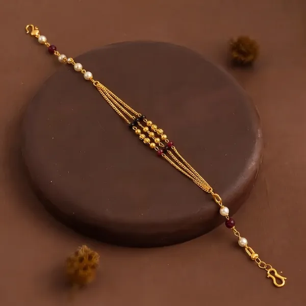 Premium_Gold-Plated_Bhabhi_Rakhi_with_Pearl_&_Ruby_Beads