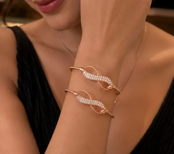 Elegant_Infinity_Twist_Gold_Plated_Diamond_Studded_Adjustable_Bracelet_Pair