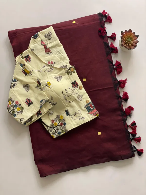 A_handcrafted_collar_blouse_paired_with_a_flowing_Khadi_saree.