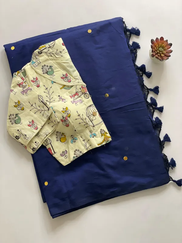 A_handcrafted_collar_blouse_paired_with_a_flowing_Khadi_saree.