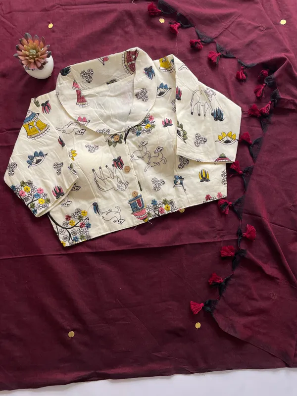 A_handcrafted_collar_blouse_paired_with_a_flowing_Khadi_saree.