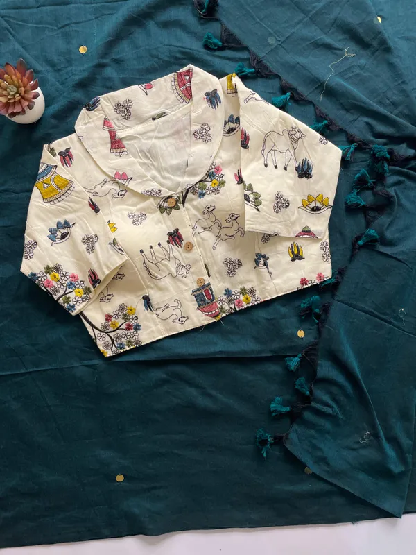 A_handcrafted_collar_blouse_paired_with_a_flowing_Khadi_saree.