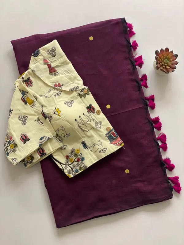 A_handcrafted_collar_blouse_paired_with_a_flowing_Khadi_saree.