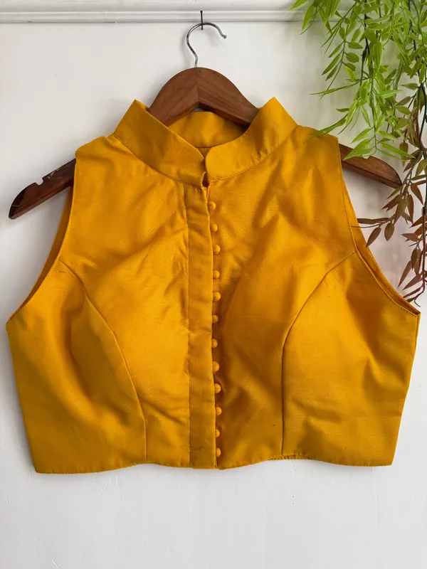 Channeling_royal_vibes_in_a_classic_high-neck_Blouse_silhouette_and_rich_crimson_tones