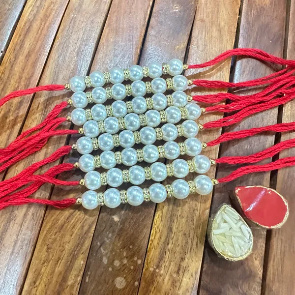 Dhivara_Pearl_Rakhi_Combo_/_Pack_Of_8_Rakhi_With_Roli_Chawal
