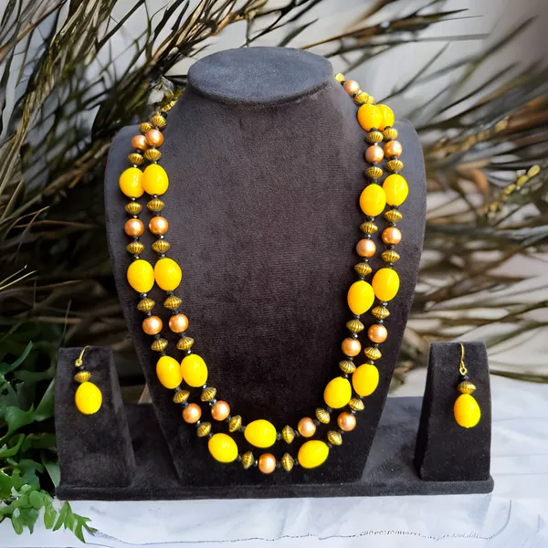 https://d1311wbk6unapo.cloudfront.net/NushopCatalogue/tr:f-webp,w-600,fo-auto/65b7523602d8dc3ec1da33d5/cat_img/Dhivara_Antique_Yellow_Beads_and_Pearl_Jewellery_set_L0JBJFOQYT_2024-09-30_1.PNG__DHIVARA