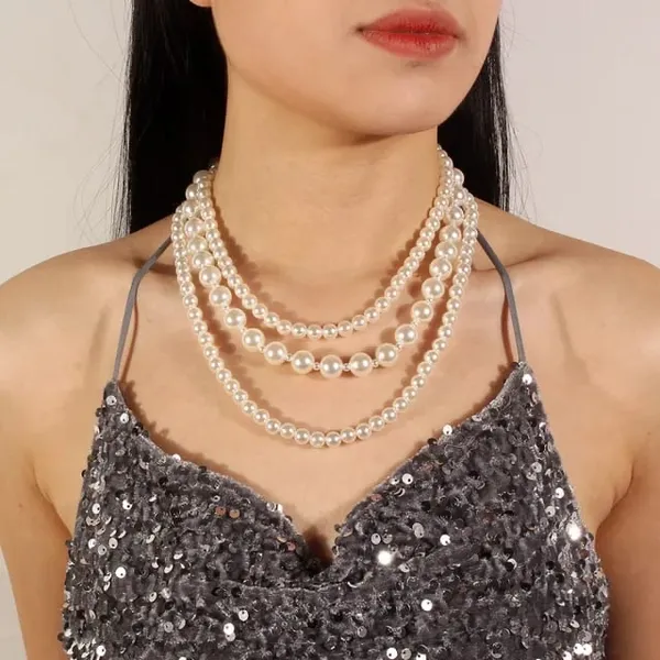 https://d1311wbk6unapo.cloudfront.net/NushopCatalogue/tr:f-webp,w-600,fo-auto/65b7523602d8dc3ec1da33d5/cat_img/Dhivara_Three_Layer_Pearl_Jewellery_Set_With_Earring_IJFNEKX8PJ_2024-09-25_1.JPG__DHIVARA