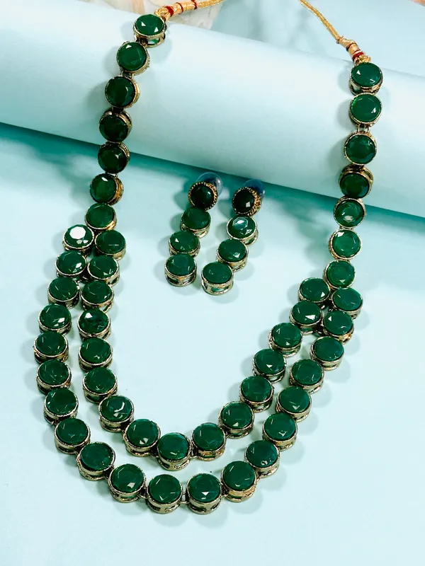 https://d1311wbk6unapo.cloudfront.net/NushopCatalogue/tr:f-webp,w-600,fo-auto/65b7523602d8dc3ec1da33d5/cat_img/Dhivara_Two_Layer_Green_Alloy_Jewellery_Set_U1RGF0O0XL_2024-10-09_1.jpeg__DHIVARA