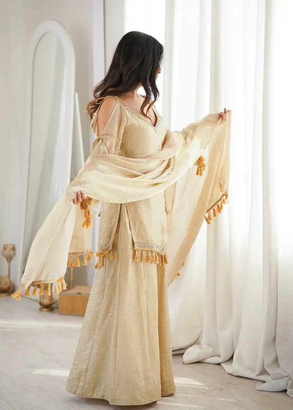 Riddhilya_Women's_Golden_Beige_Embellished_Kurta_Palazzo_Set_with_Tassel_Dupatta_|_Festive_&_Party_Wear_Ethnic_Suit
