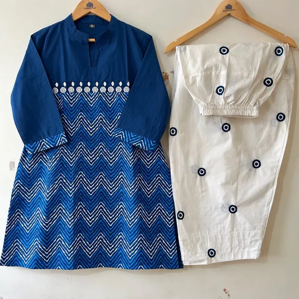 Navy_Blue_Printed_Kurti_paired_with_a_White_Embroidered_evil_eye_Farshi_Salwar