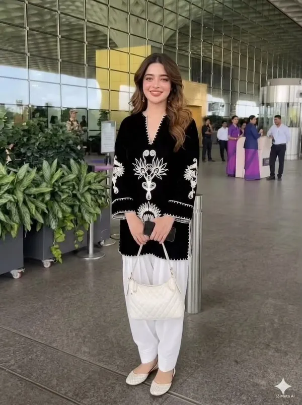 Royal_Black_Kurti_is_paired_with_an_elegant_Off-White_Farshi_Salwar