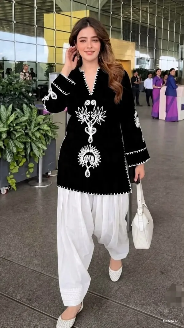 Royal_Black_Kurti_is_paired_with_an_elegant_Off-White_Farshi_Salwar