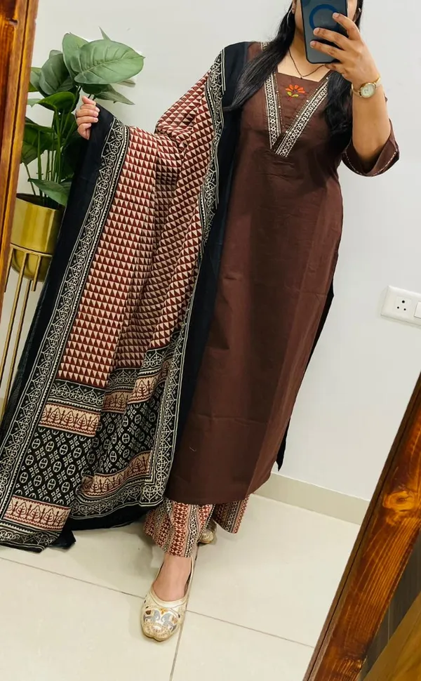 Dhabu_cotton_suit_set_with_heavy_embroidery_work_on_the_yoke_and_pockets__with_border_detailing_on_Sleeves.